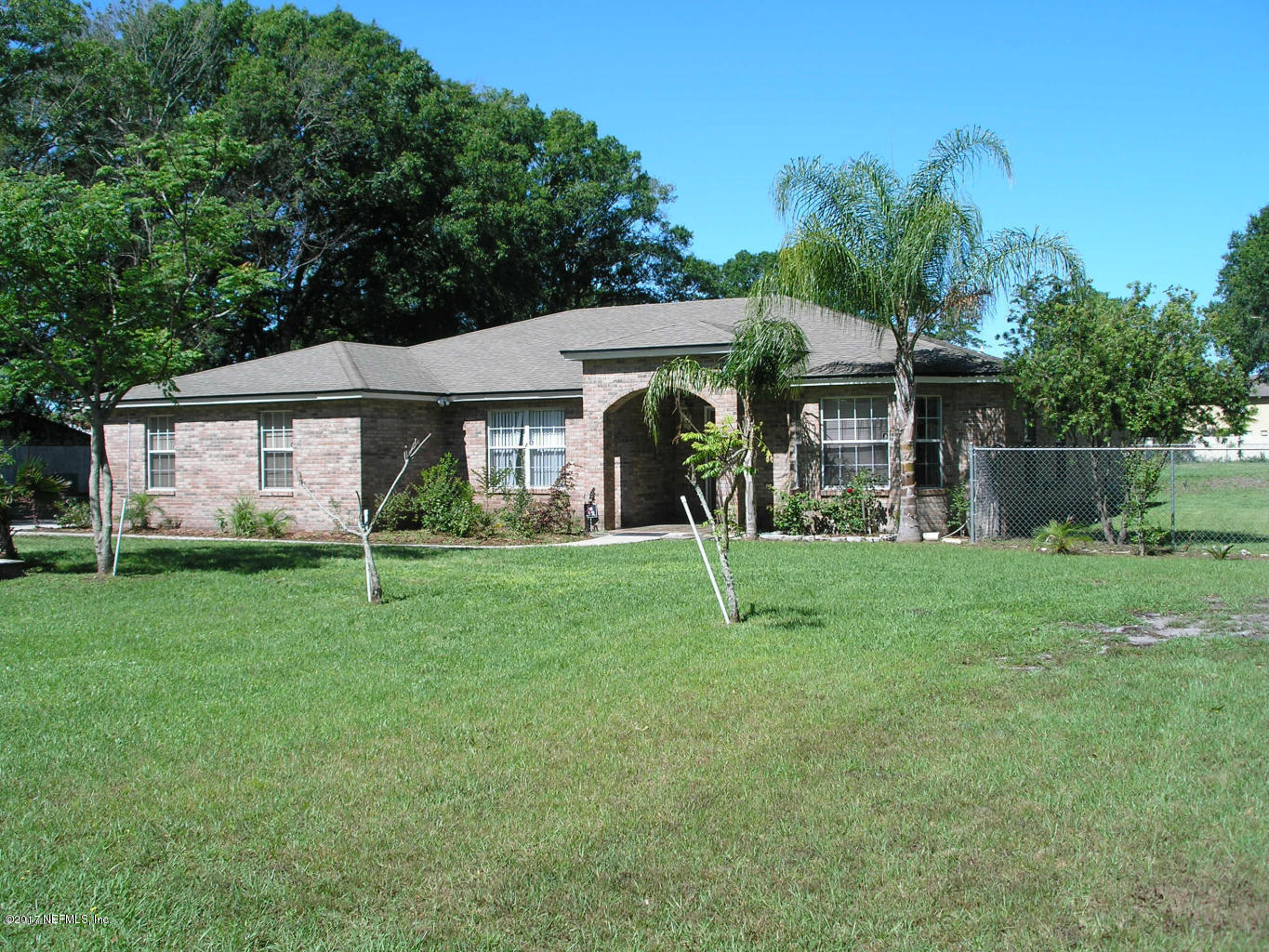 4822 Ricker Road Jacksonville, FL 32210 - Photo 5 of 50 a view of a house with a backyard