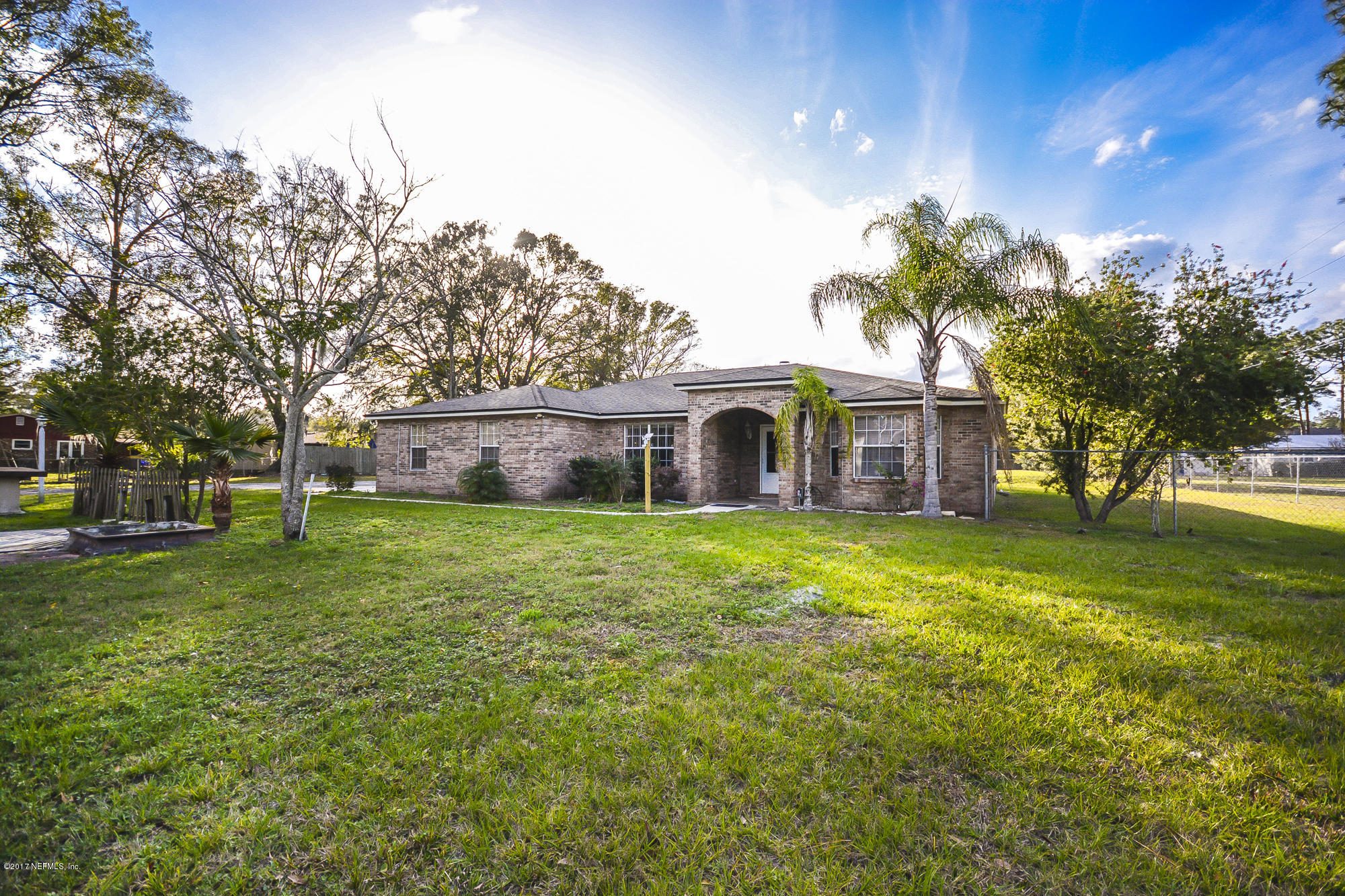 4822 Ricker Road Jacksonville, FL 32210 - Photo 6 of 50 a front view of a house with a garden and porch