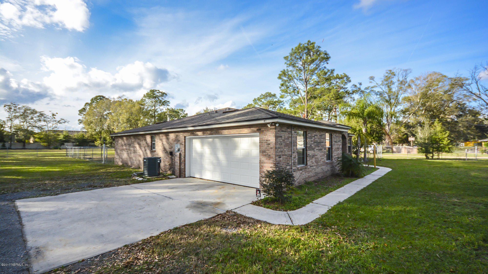 4822 Ricker Road Jacksonville, FL 32210 - Photo 7 of 50 a view of a house with a yard
