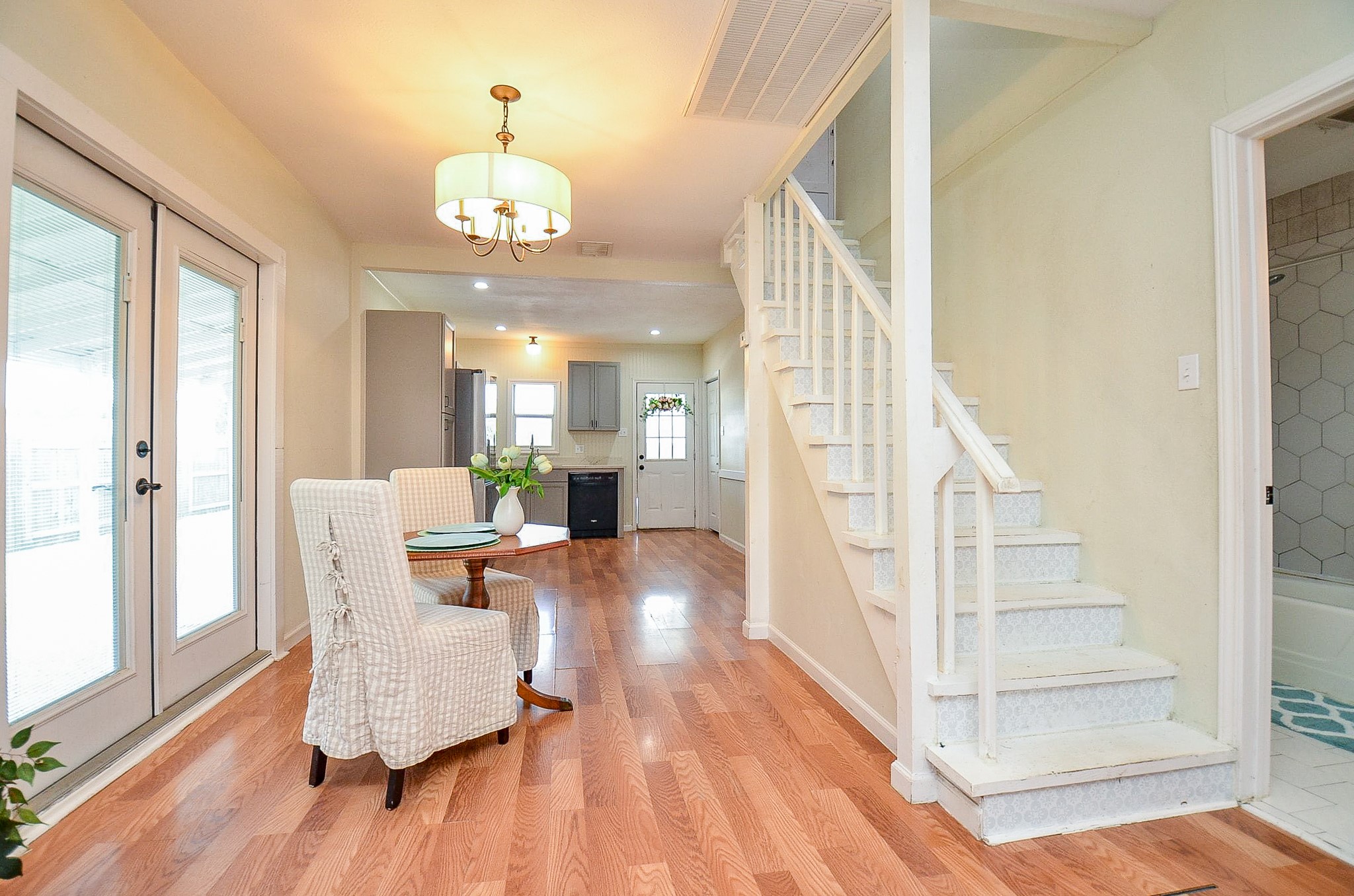 1615 Eagle Lake Road Sealy, TX 77474 - Photo 6 of 19 This casual dining space is flanked by double French doors that lead to the outside living spaces, and the staircase with tile design that leads to the upstairs living spaces!