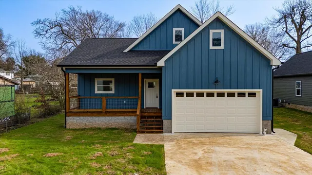 a view of house with backyard