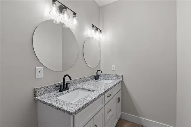 a bathroom with a sink and a mirror