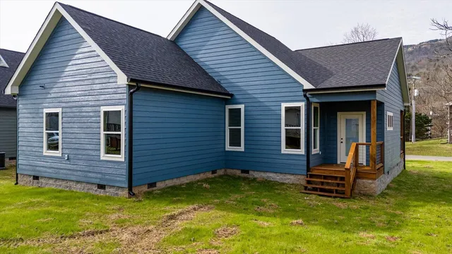 a backyard of a house with barbeque oven