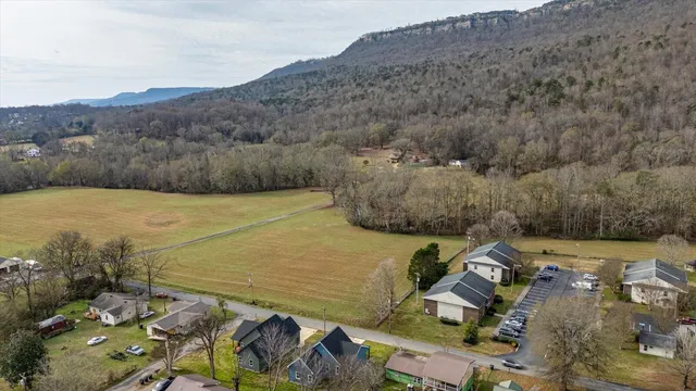 an aerial view of a house with a yard