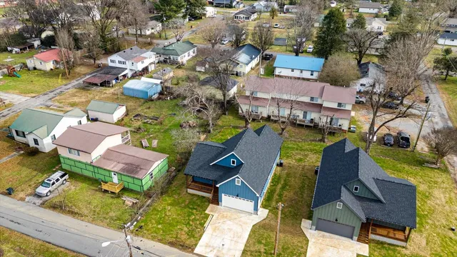 an aerial view of a house with a swimming pool