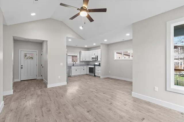 a view of a kitchen with a sink and a window