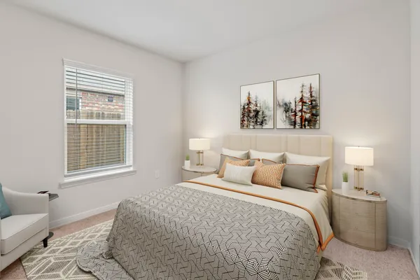 a bedroom with a bed and a couch