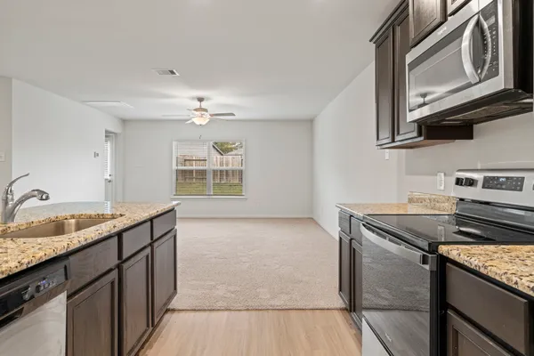a kitchen with a sink and a stove