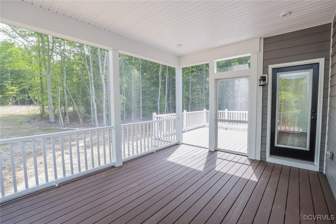 16877 Watchman Way Beaverdam, VA 23015 - Photo 9 of 15 a view of a room with wooden floor and balcony