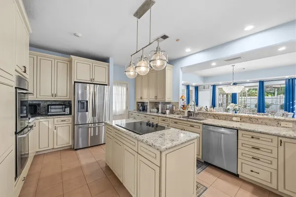 a kitchen with a sink stove and cabinets