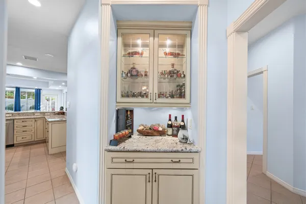 a large kitchen with kitchen island a sink stove and refrigerator