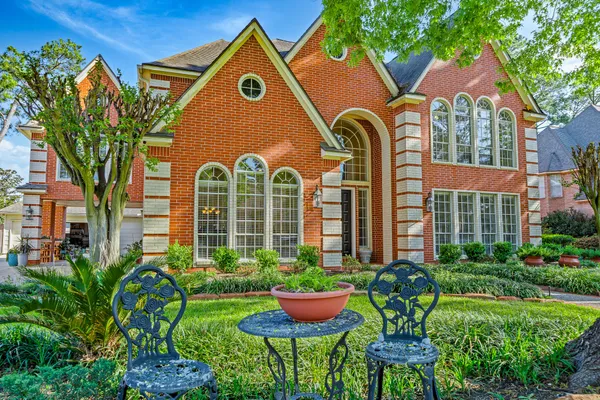 a front view of house with yard and outdoor seating