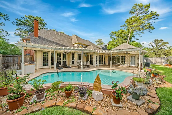 a view of a swimming pool with a patio