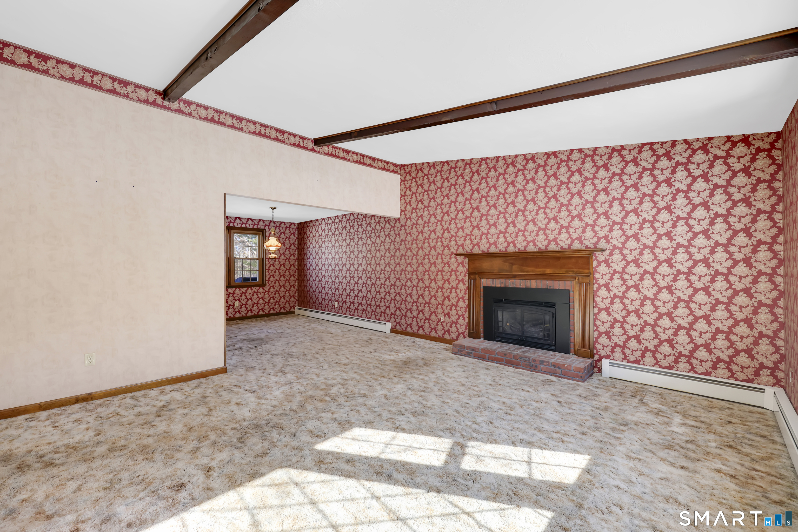 102 Robin Circle Tolland, CT 06084 - Photo 2 of 37 a view of empty room with a fireplace
