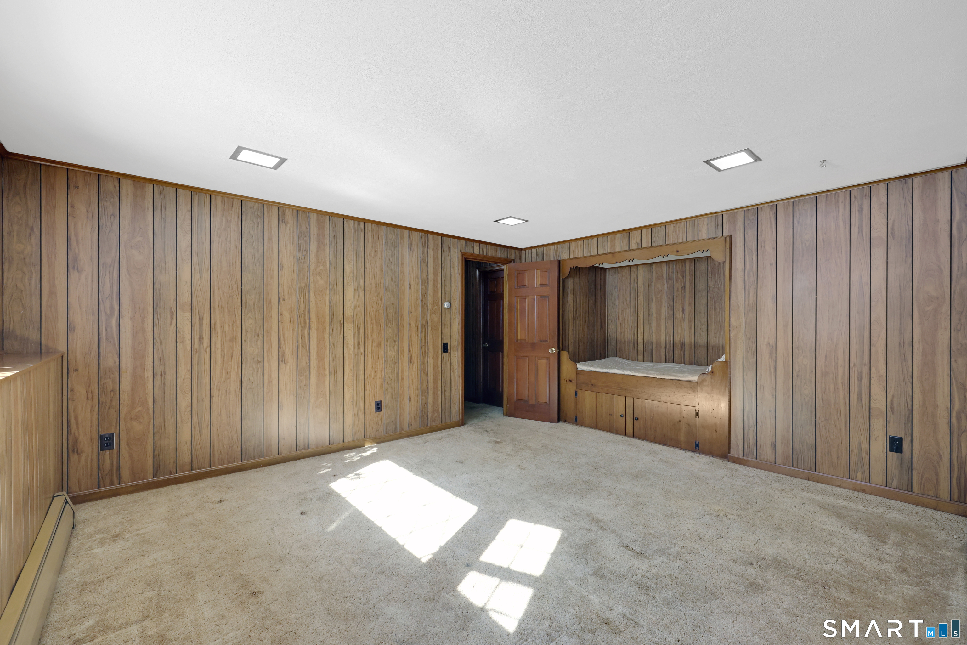102 Robin Circle Tolland, CT 06084 - Photo 25 of 37 a view of an empty room with wooden walls