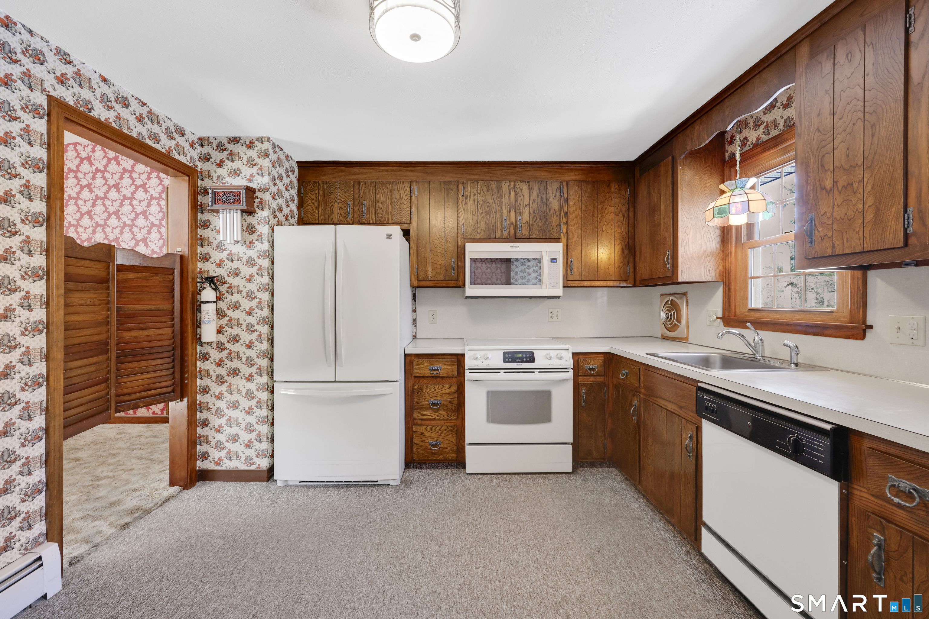 102 Robin Circle Tolland, CT 06084 - Photo 9 of 37 a kitchen with stainless steel appliances granite countertop a refrigerator sink stove microwave and stove