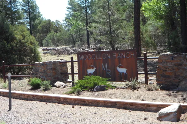 a view of a backyard with sitting area