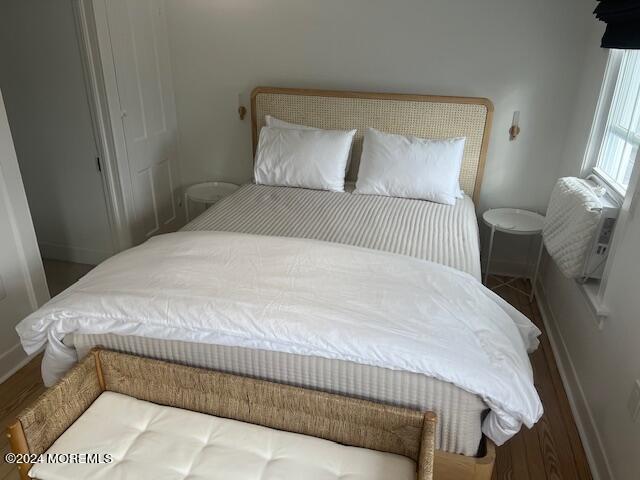 113 Webb Avenue, Unit WINTER Ocean Grove, NJ 07756 - Photo 24 of 31 a bed sitting in a bedroom next to a window