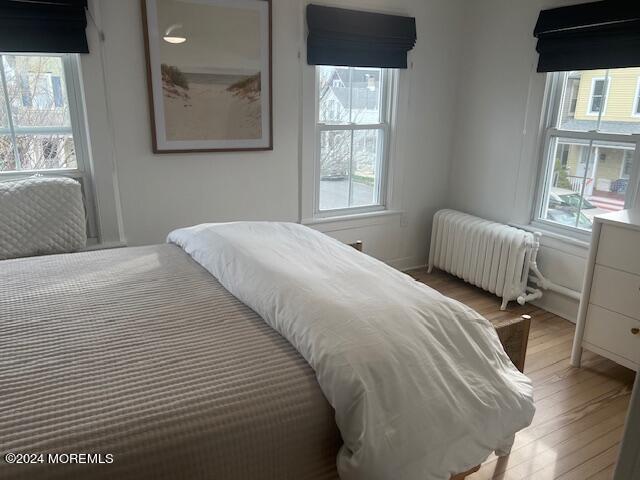 113 Webb Avenue, Unit WINTER Ocean Grove, NJ 07756 - Photo 25 of 31 a bedroom with a bed and a window