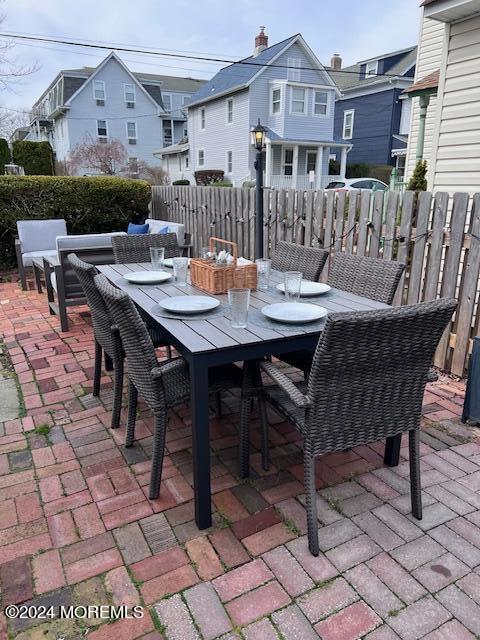 113 Webb Avenue, Unit WINTER Ocean Grove, NJ 07756 - Photo 8 of 31 a view of a house with a table and chairs