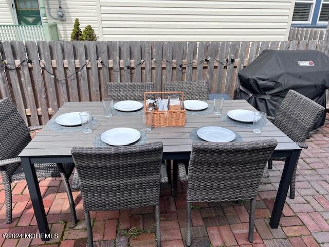 113 Webb Avenue, Unit WINTER Ocean Grove, NJ 07756 - Photo 10 of 31 a table and chairs in a patio