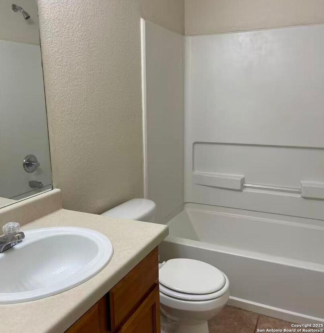 7301 Longing Trail, Unit 1 San Antonio, TX 78244 - Photo 13 of 16 a bathroom with a sink and a toilet