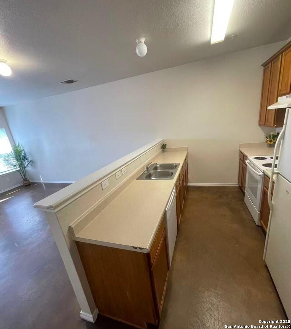 7301 Longing Trail, Unit 1 San Antonio, TX 78244 - Photo 4 of 16 a utility room with washer and dryer