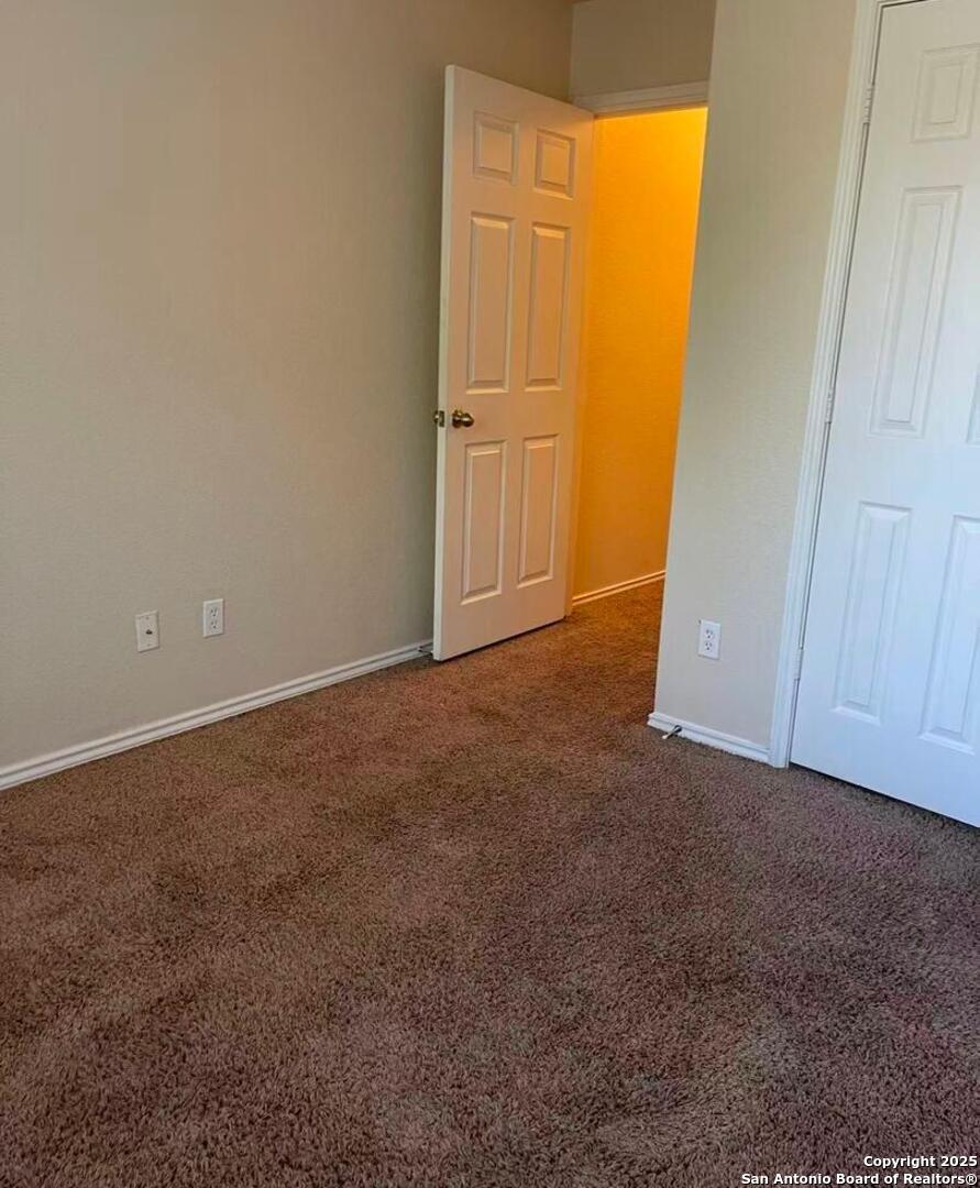 7301 Longing Trail, Unit 1 San Antonio, TX 78244 - Photo 9 of 16 an empty room with closet area