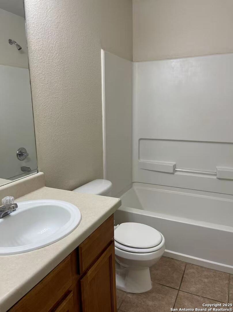 7301 Longing Trail, Unit 1 San Antonio, TX 78244 - Photo 10 of 16 a bathroom with a sink a toilet and shower