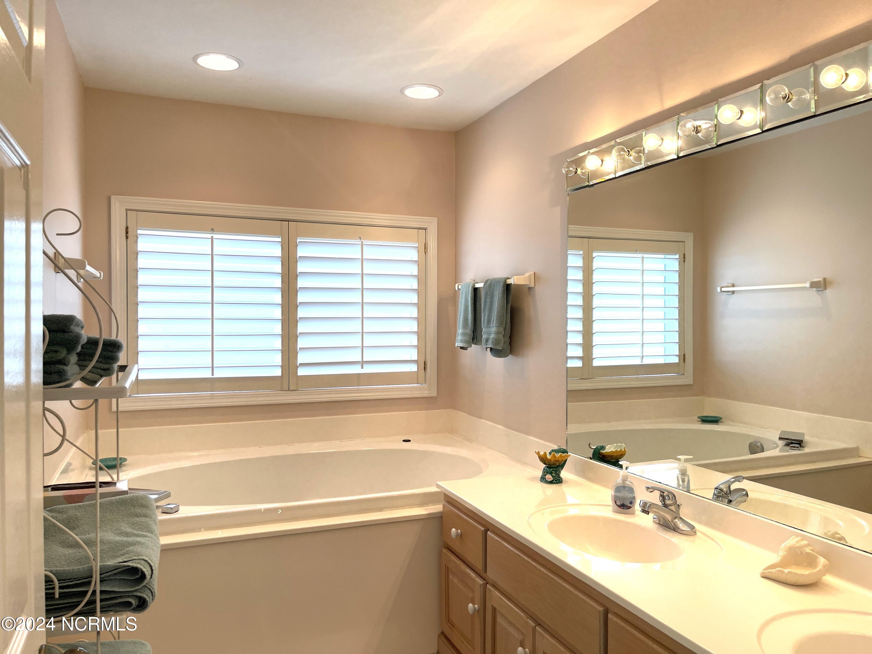 1006 East Main Street, Unit B Sunset Beach, NC 28468 - Photo 29 of 39 Primary Bath Second Level