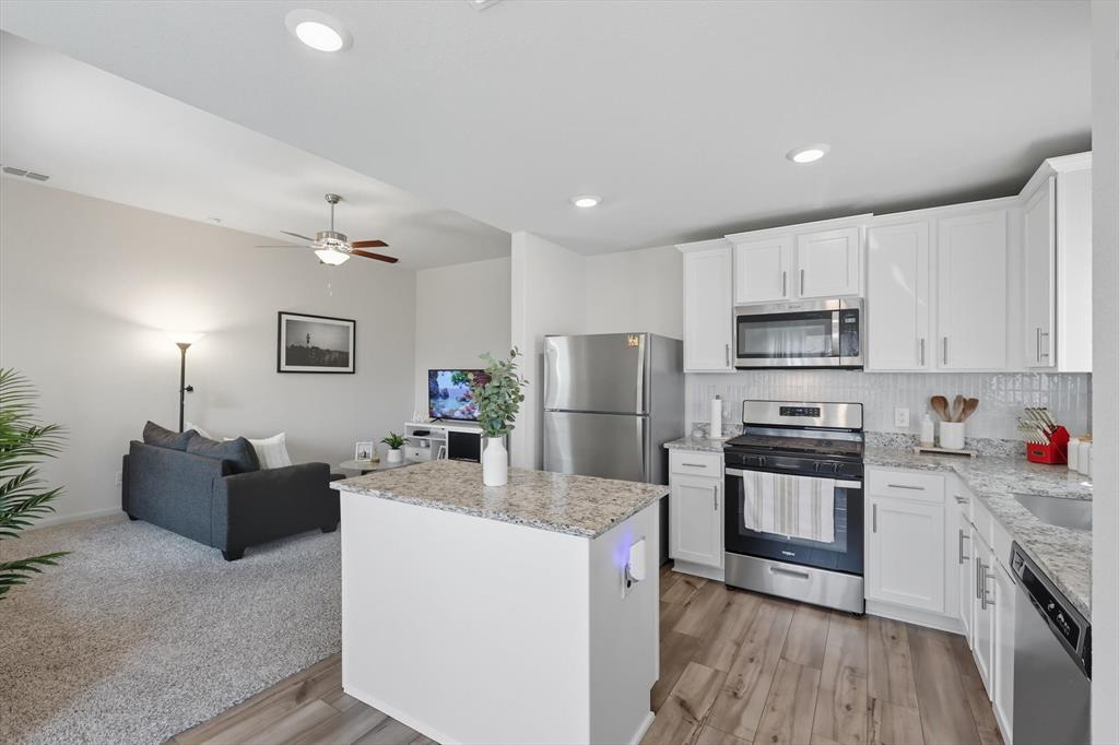 13511 Mineral Road Ponder, TX 76259 - Photo 40 of 40 a kitchen with stainless steel appliances a refrigerator stove microwave and sink