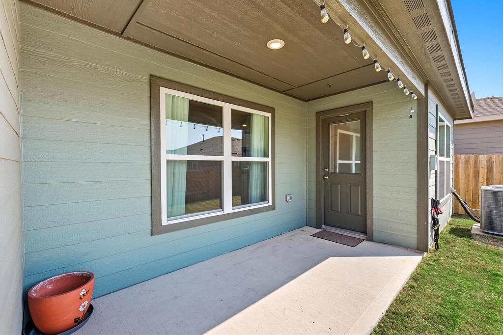 13511 Mineral Road Ponder, TX 76259 - Photo 32 of 40 a front view of a house with a yard