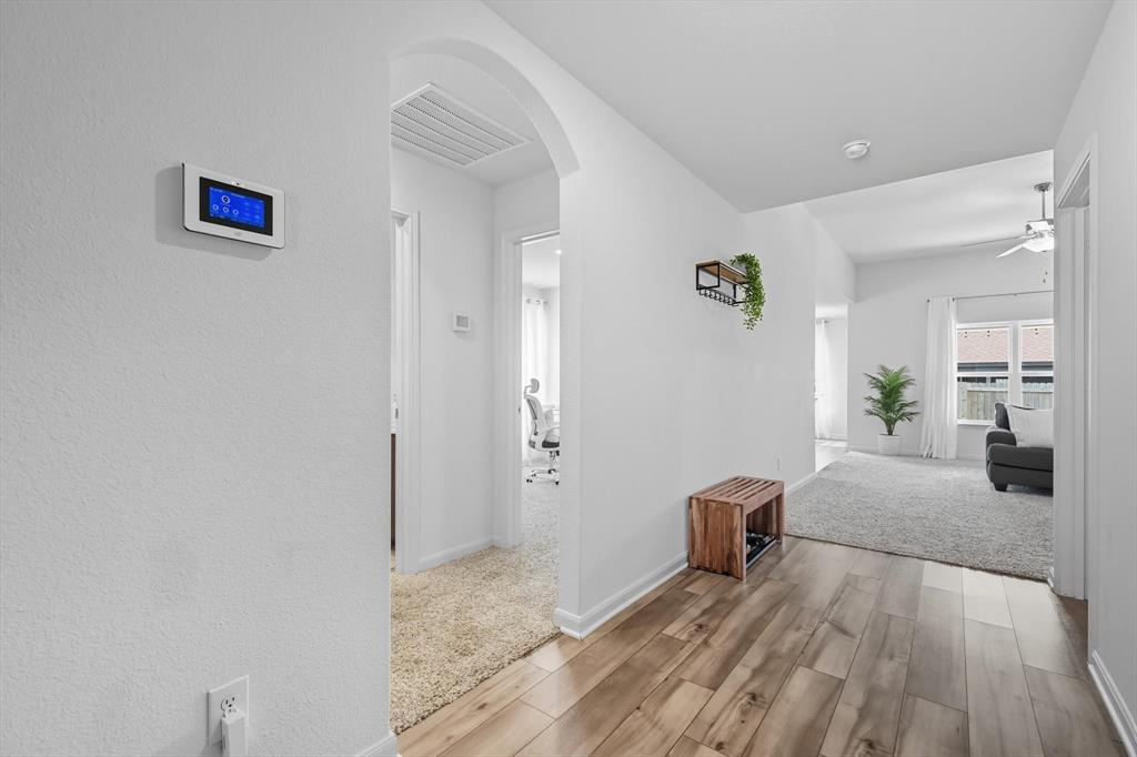 13511 Mineral Road Ponder, TX 76259 - Photo 7 of 40 a bedroom with a bed and view of living room