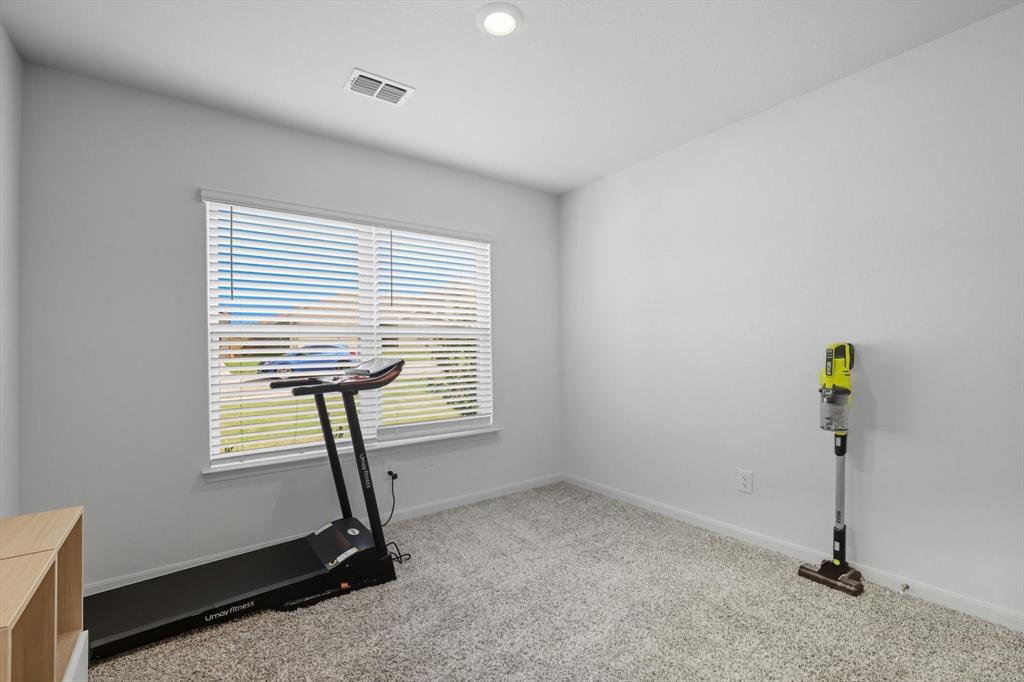 13511 Mineral Road Ponder, TX 76259 - Photo 10 of 40 a room with gym equipment and a window