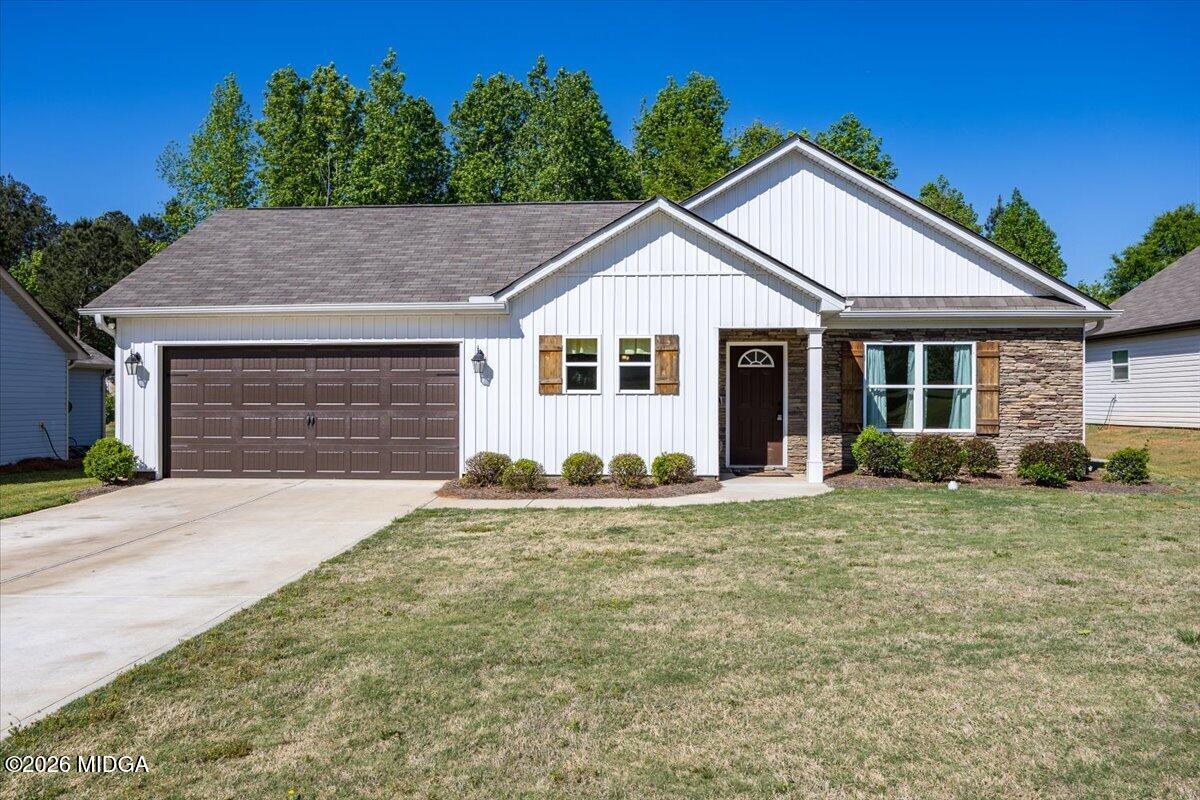 845 Natures Walk Gray, GA 31032 - Photo 1 of 21 front view of a house and a yard