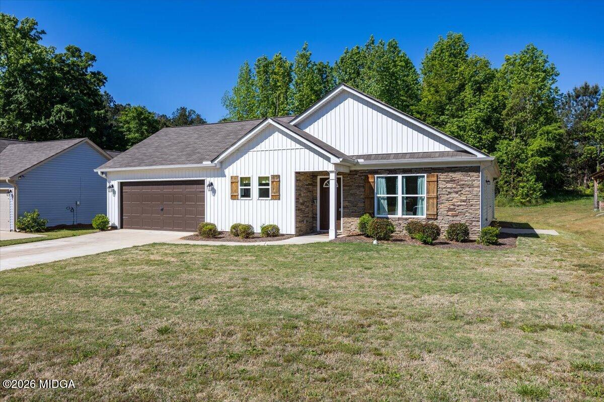 845 Natures Walk Gray, GA 31032 - Photo 2 of 21 a house with trees in the background