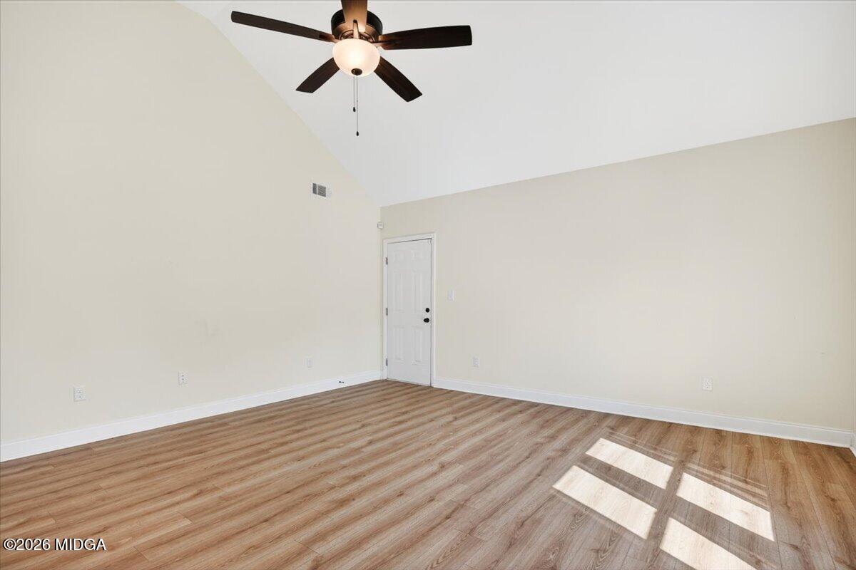845 Natures Walk Gray, GA 31032 - Photo 3 of 21 a view of a room with wooden floor and carpet