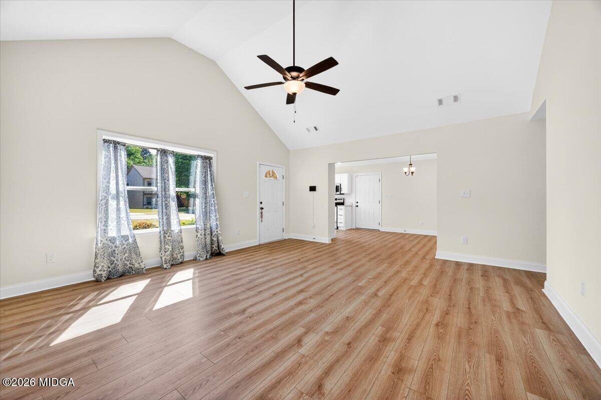 845 Natures Walk Gray, GA 31032 - Photo 5 of 21 a view of a room with wooden floor and white walls