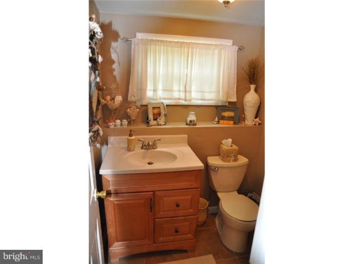 739 Spruce Road Warminster, PA 18974 - Photo 11 of 19 a bathroom with a sink toilet and mirror