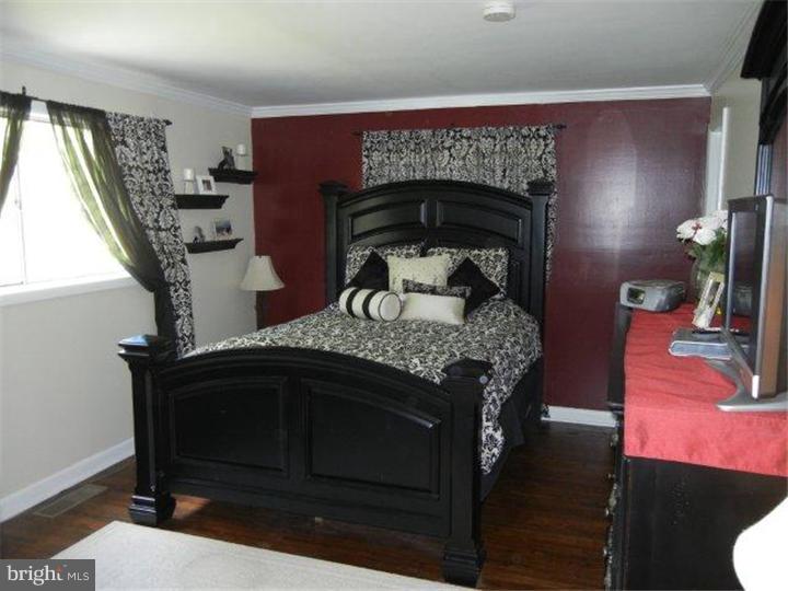 739 Spruce Road Warminster, PA 18974 - Photo 12 of 19 a bedroom with a bed and a fireplace