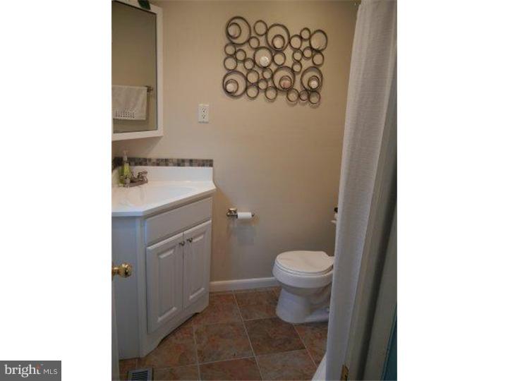 739 Spruce Road Warminster, PA 18974 - Photo 13 of 19 a bathroom with a toilet sink and mirror