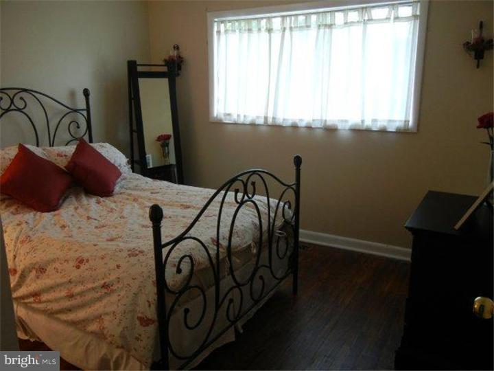 739 Spruce Road Warminster, PA 18974 - Photo 14 of 19 a view of a door and chair in a room