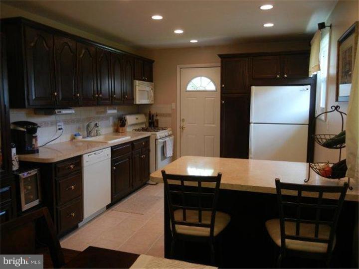 739 Spruce Road Warminster, PA 18974 - Photo 5 of 19 a kitchen with a sink cabinets and wooden floor