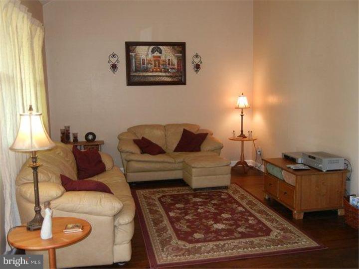 739 Spruce Road Warminster, PA 18974 - Photo 7 of 19 a living room with furniture and a lamp