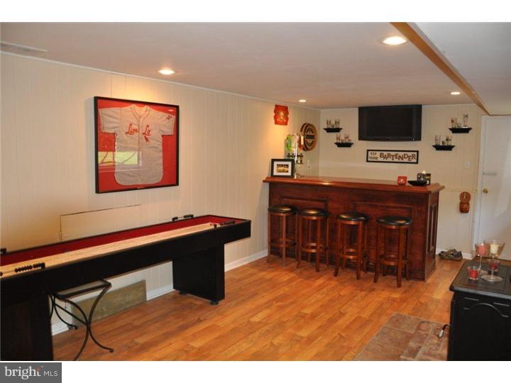 739 Spruce Road Warminster, PA 18974 - Photo 10 of 19 a room with a flat screen tv