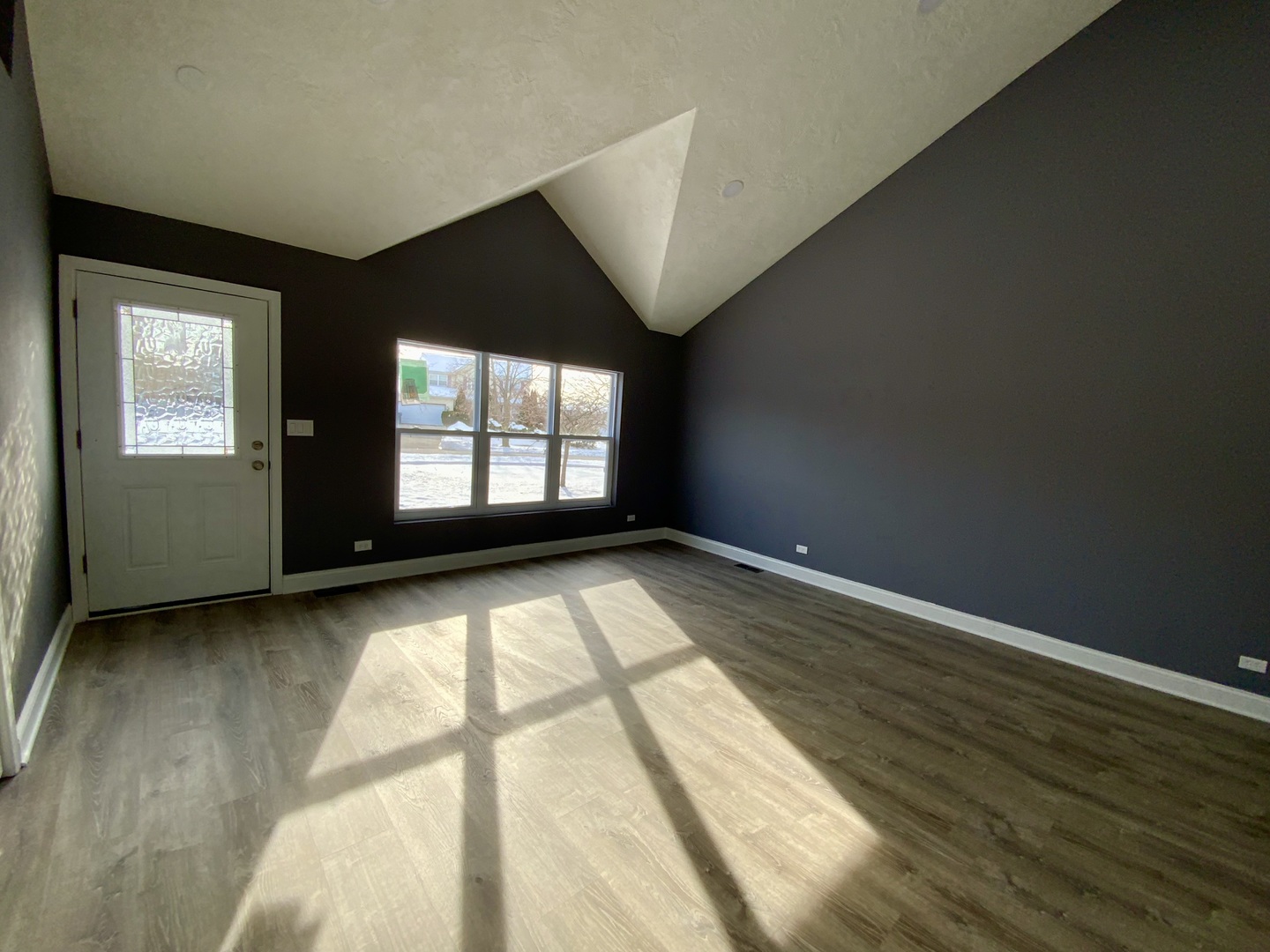 4014 Ridge Road Zion, IL 60099 - Photo 8 of 21 an empty room with wooden floor and windows
