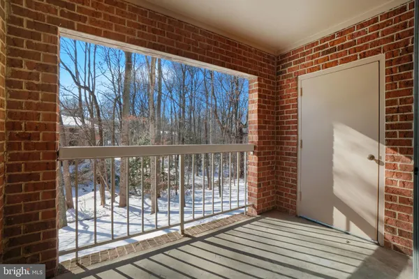 a view of a balcony with wooden floor