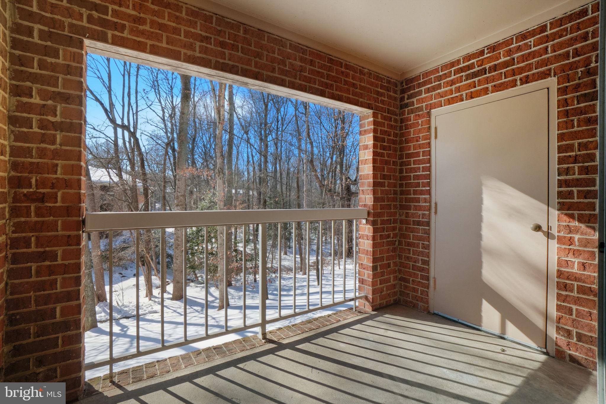 5902 Cove Landing Road, Unit 203 Burke, VA 22015 - Photo 11 of 25 a view of a balcony with wooden floor