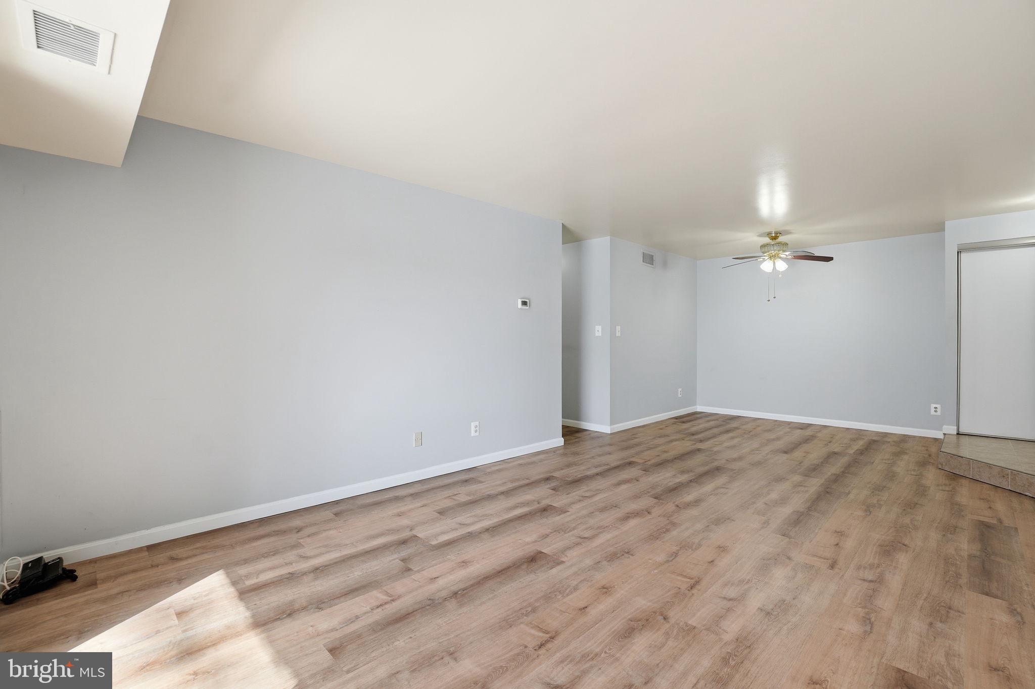 5902 Cove Landing Road, Unit 203 Burke, VA 22015 - Photo 15 of 25 a view of empty room with ceiling fan