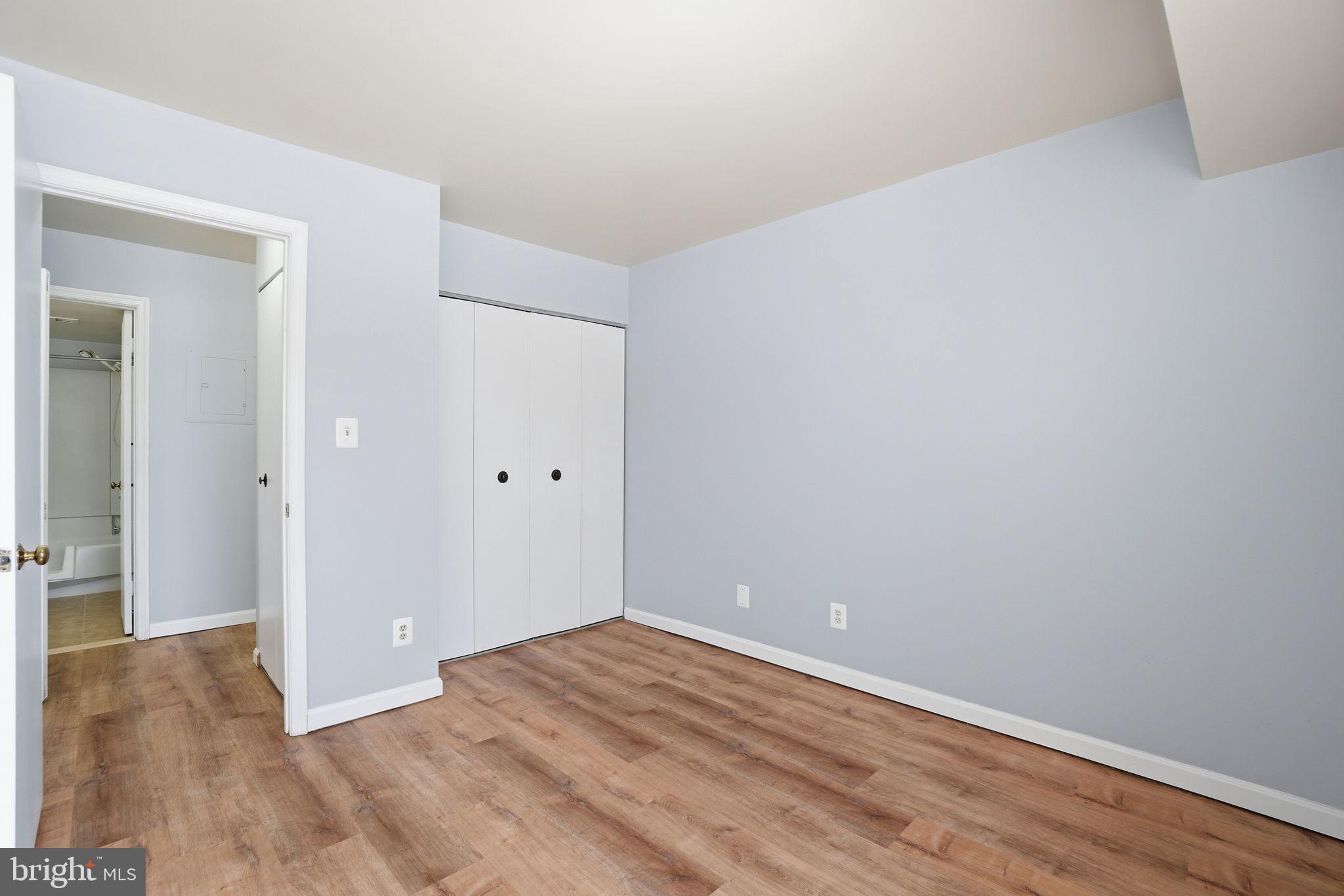 5902 Cove Landing Road, Unit 203 Burke, VA 22015 - Photo 18 of 25 wooden floor in an empty room